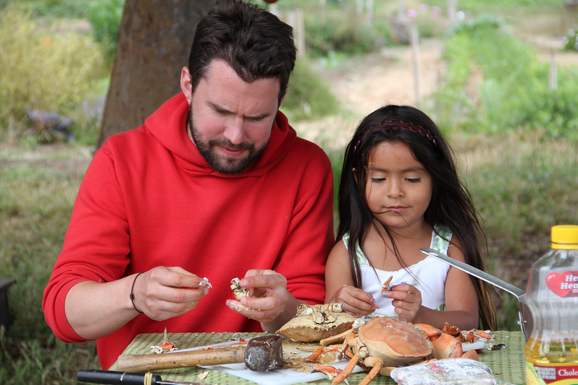 Daniel Klein picks meat from crabs with the young daughter of a former strawberry picker in Oxnard, Calif., for an episode called "A Day In The Life." Film And Food: Sharing The Stories Of Immigrants With Conservative America | WGBH | Craving Boston
